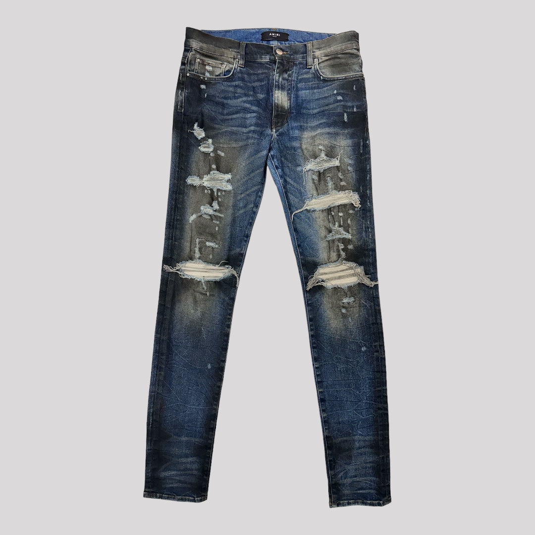 Amiri Dirty Indigo Cashmere Patch MX1 Distressed Denim Jeans